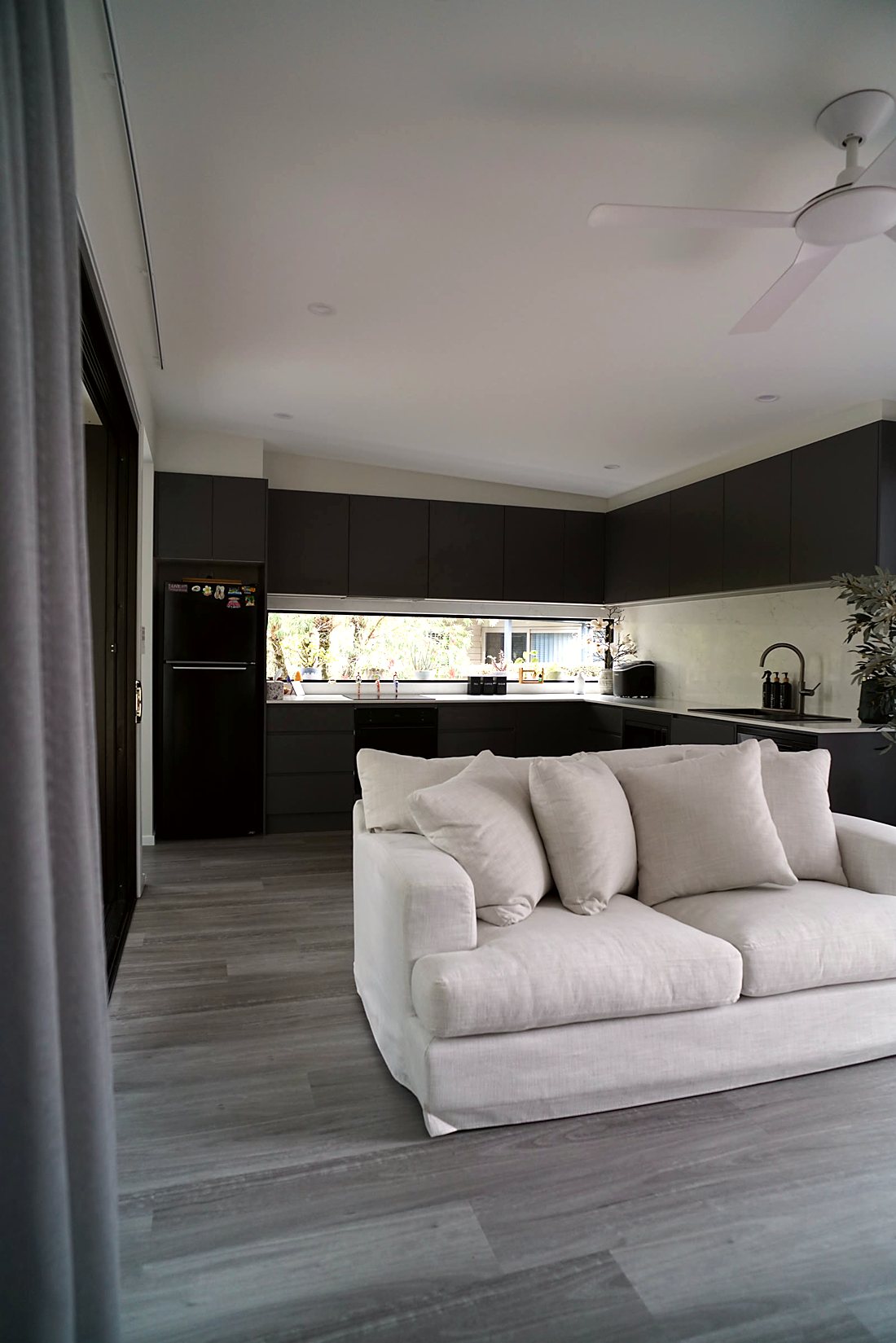 Open-plan living room and kitchen inside a Coastline Studios home